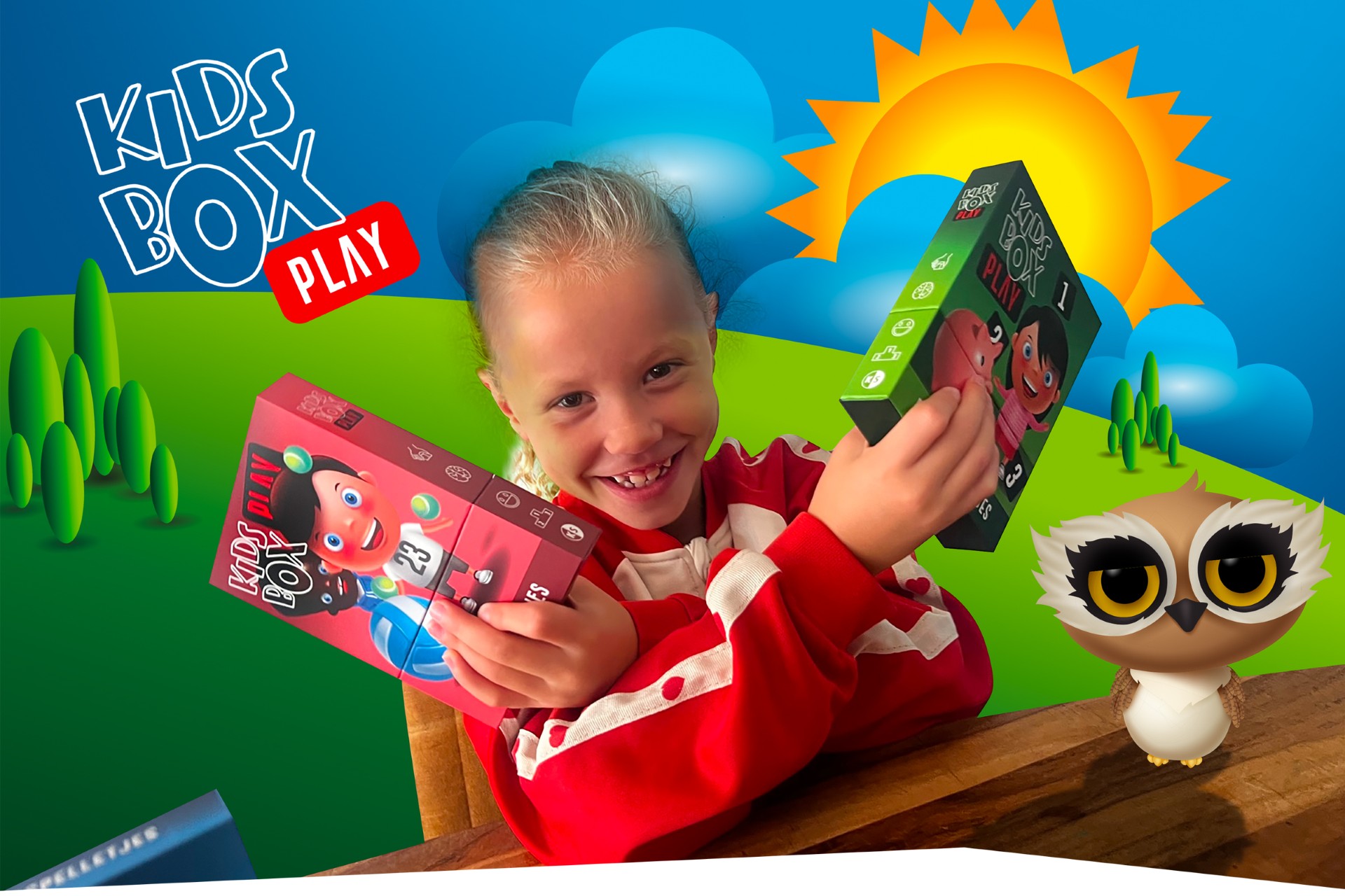 Young girl smiling while holding two colorful Kids Box Plan boxes against a bright cartoon landscape.